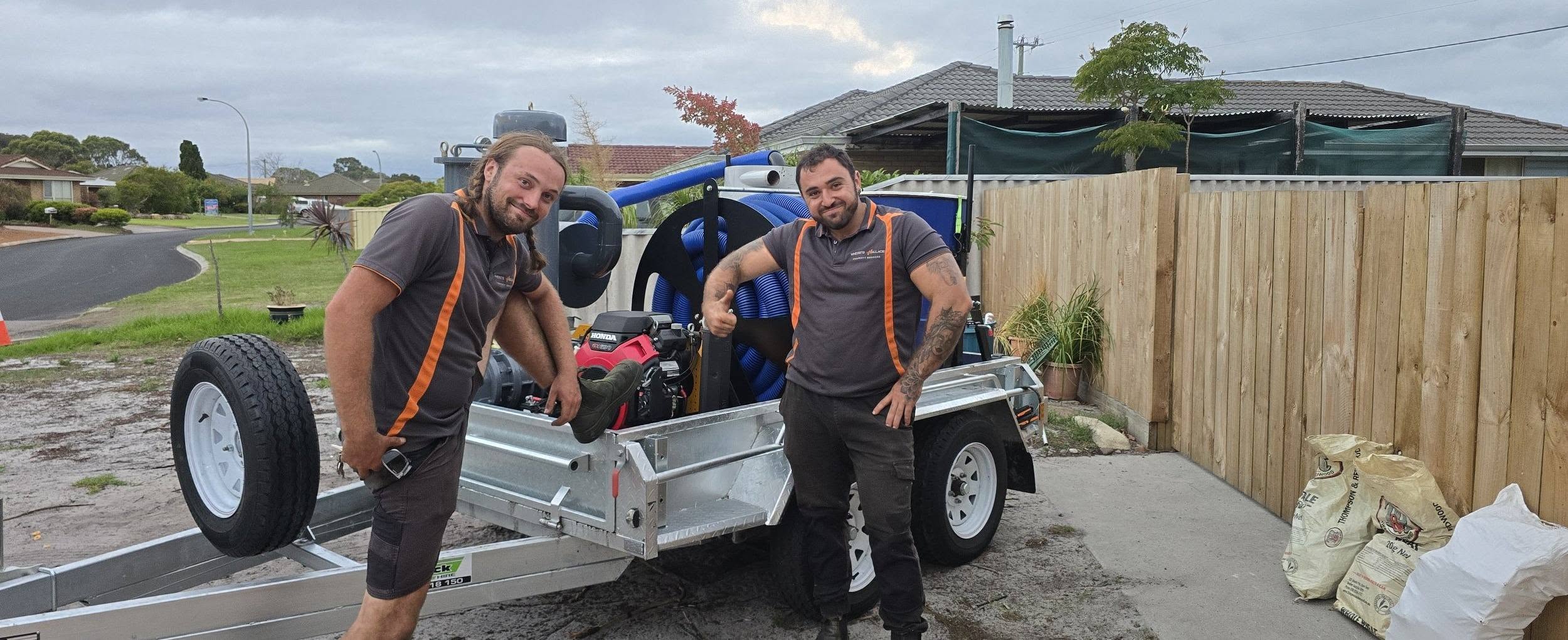 Where's Wallace team loading the trailer for a rubbish removal